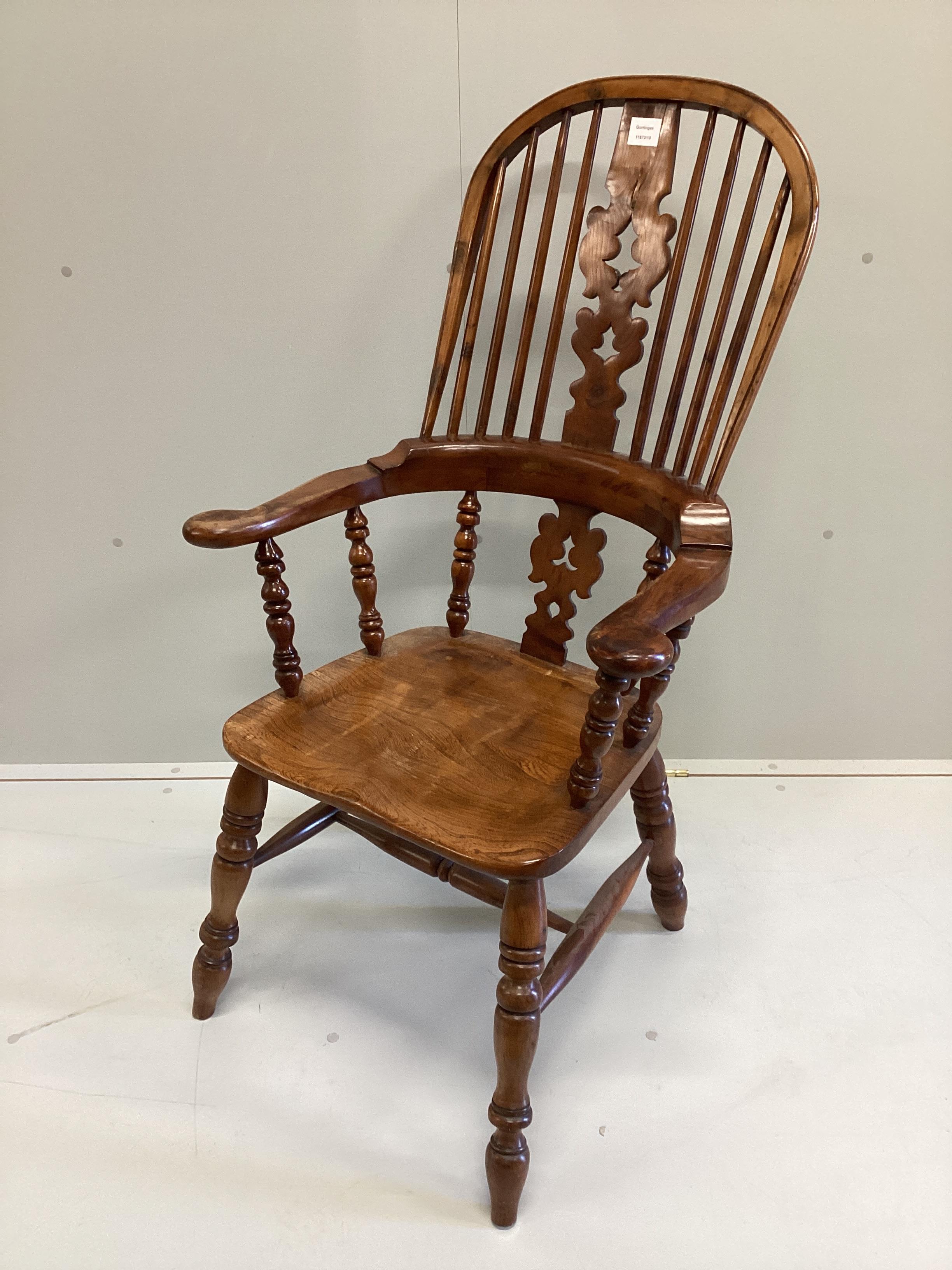 A reproduction yew and elm Yorkshire style Windsor armchair, width 64cm, depth 42cm, height 114cm.